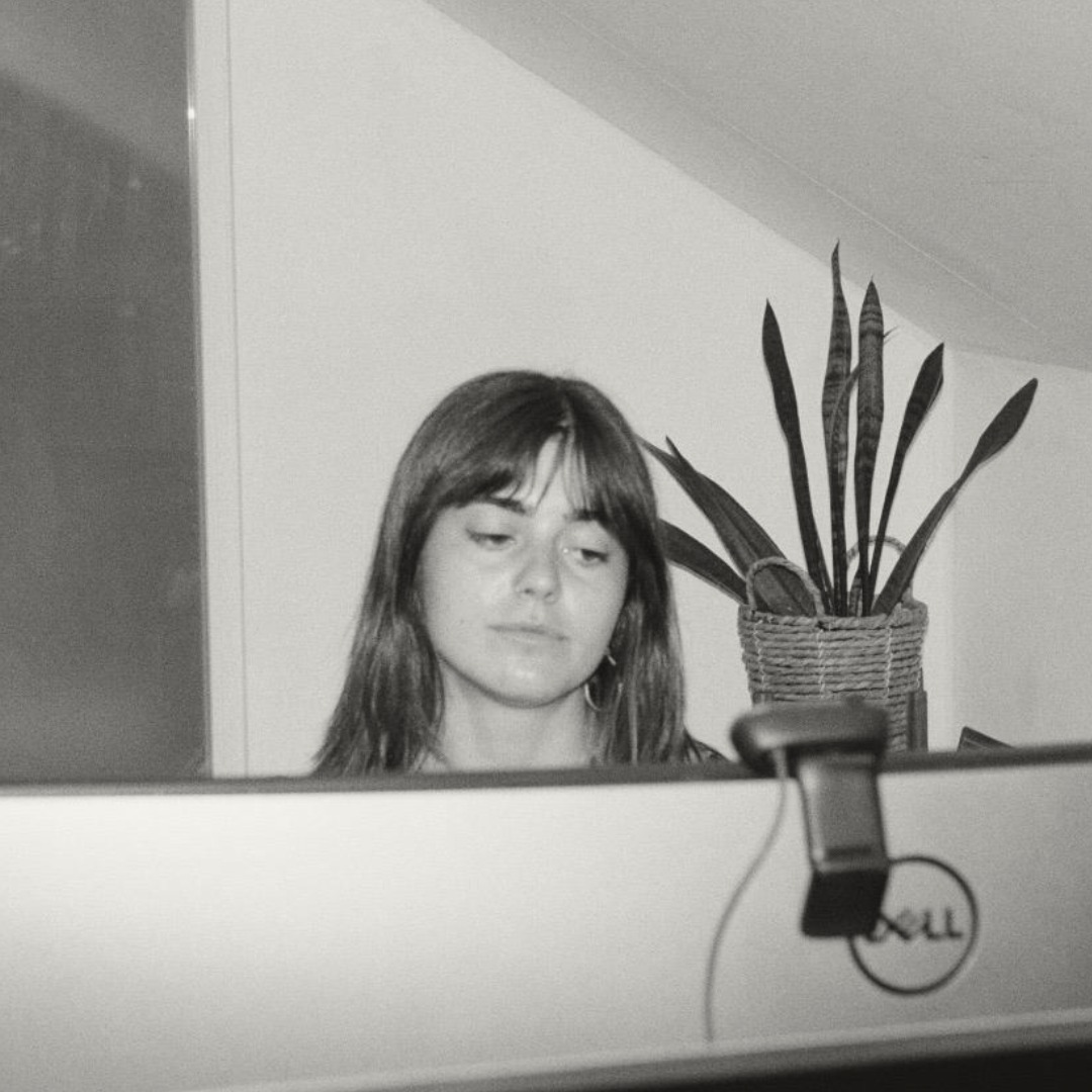 Picture of Sara Lopez behind a computer.