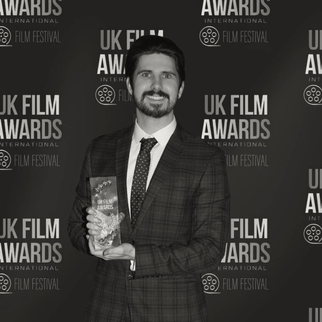 Jake Lee, Escapeverse Live host, at the UK Film Awards holding an award.