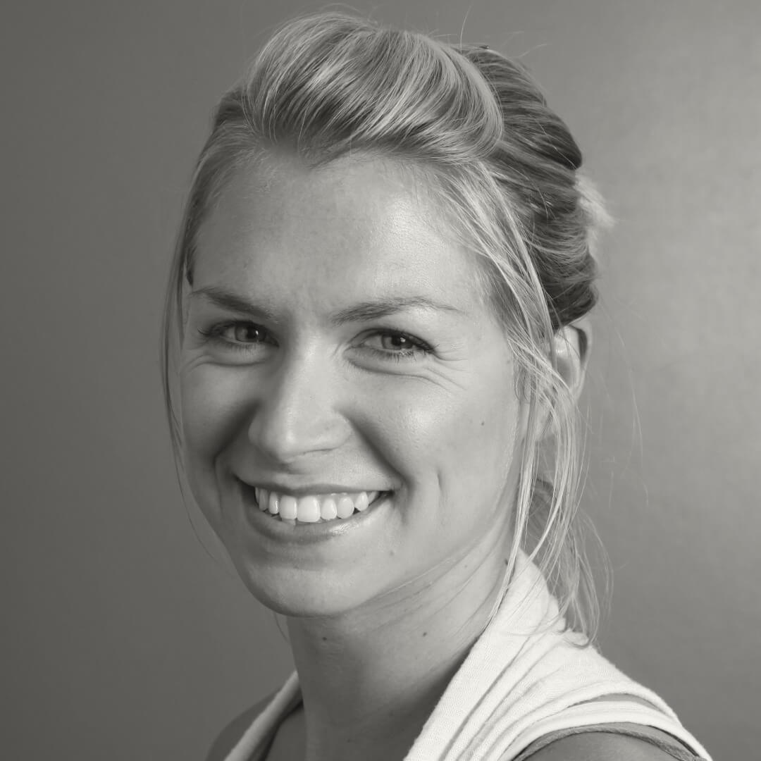Headshot of Ellie Koorlander, who is smiling at the camera