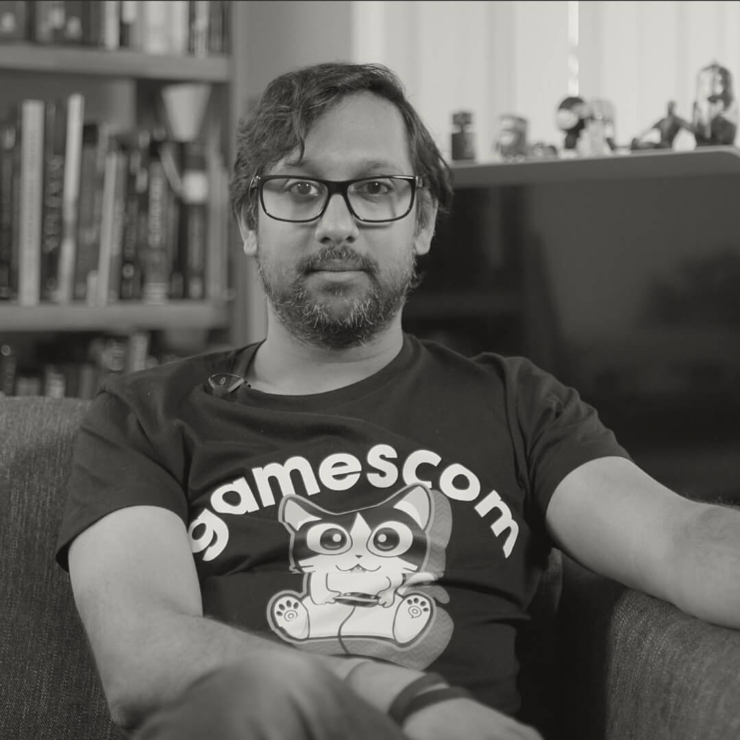 Image shows Haz Dullul sat facing the camera with a neutral expression.