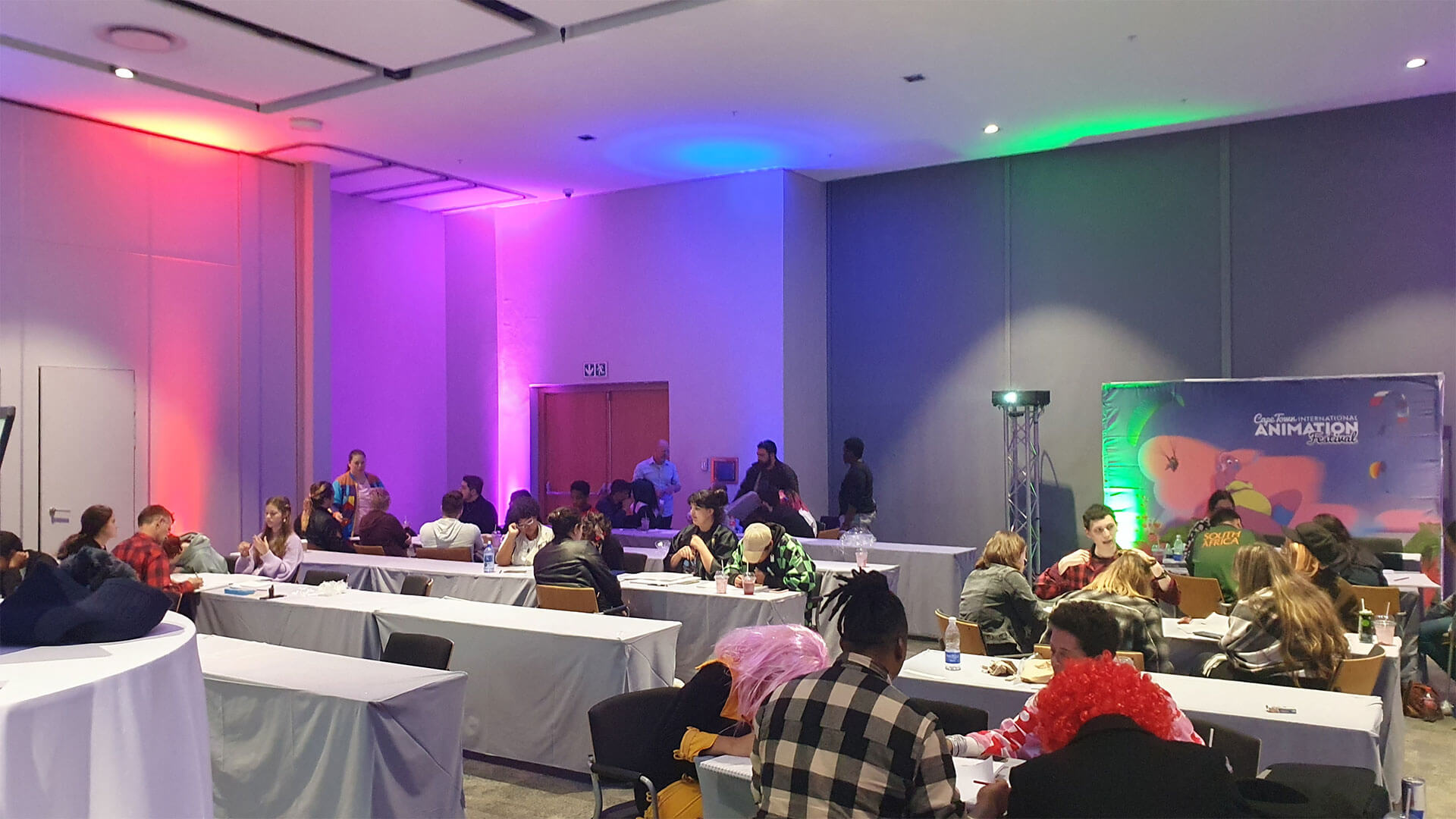 Students sat around tables at an Animation conference for a Houdini workshop