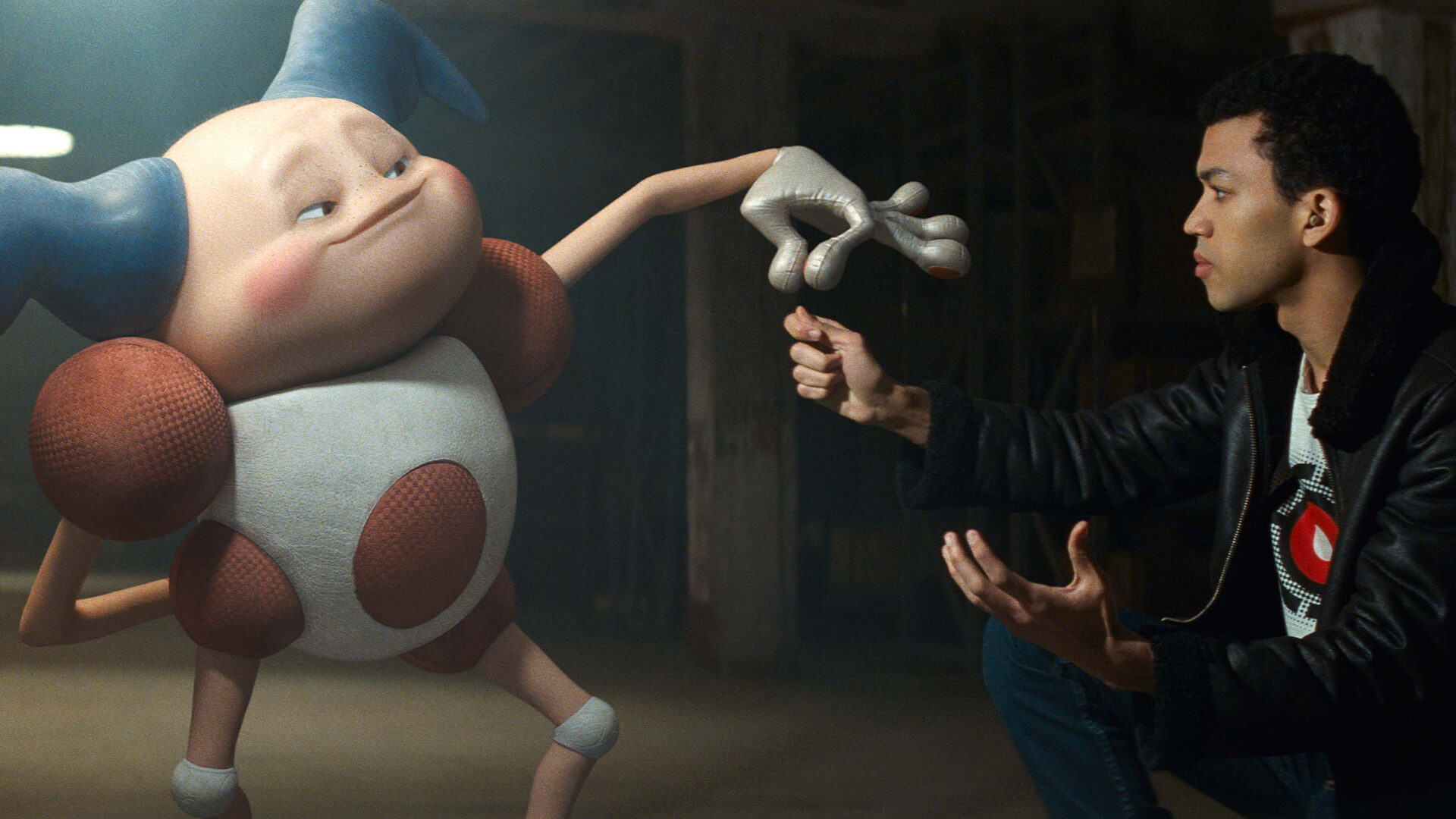 Animated jester character holding hands with a male