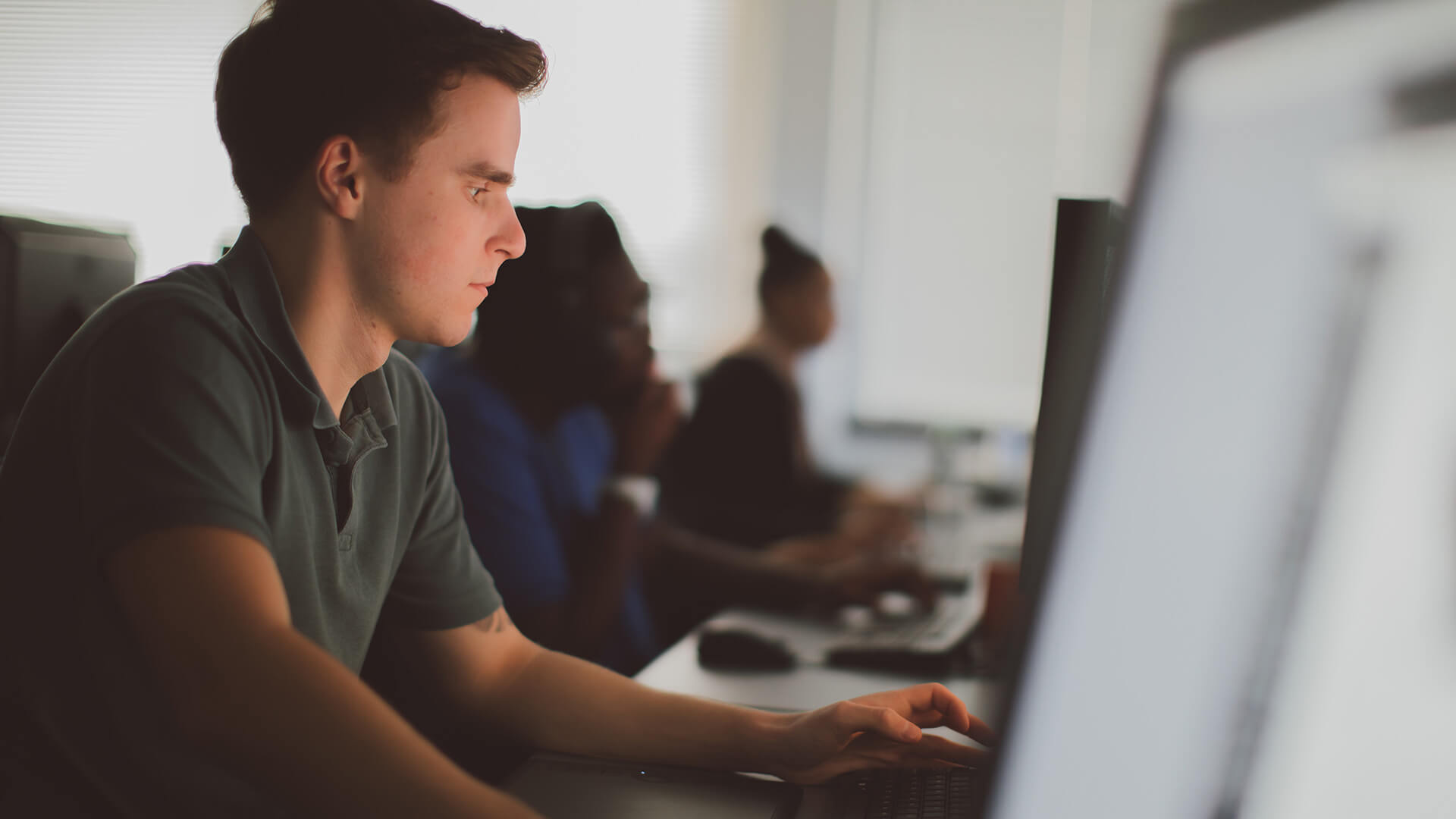 Male student using computer
