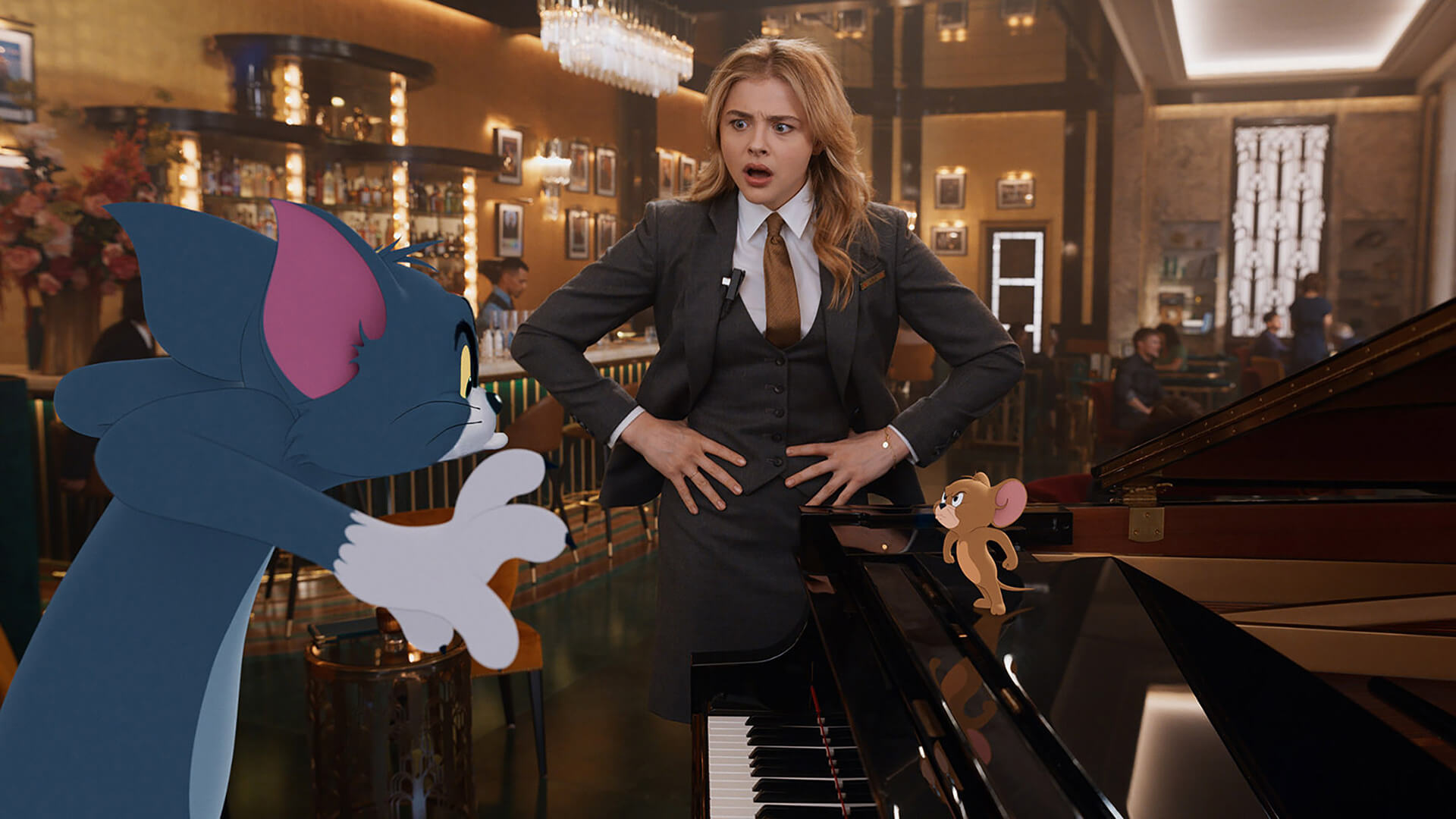 Female character shouting at an animated cat and mouse