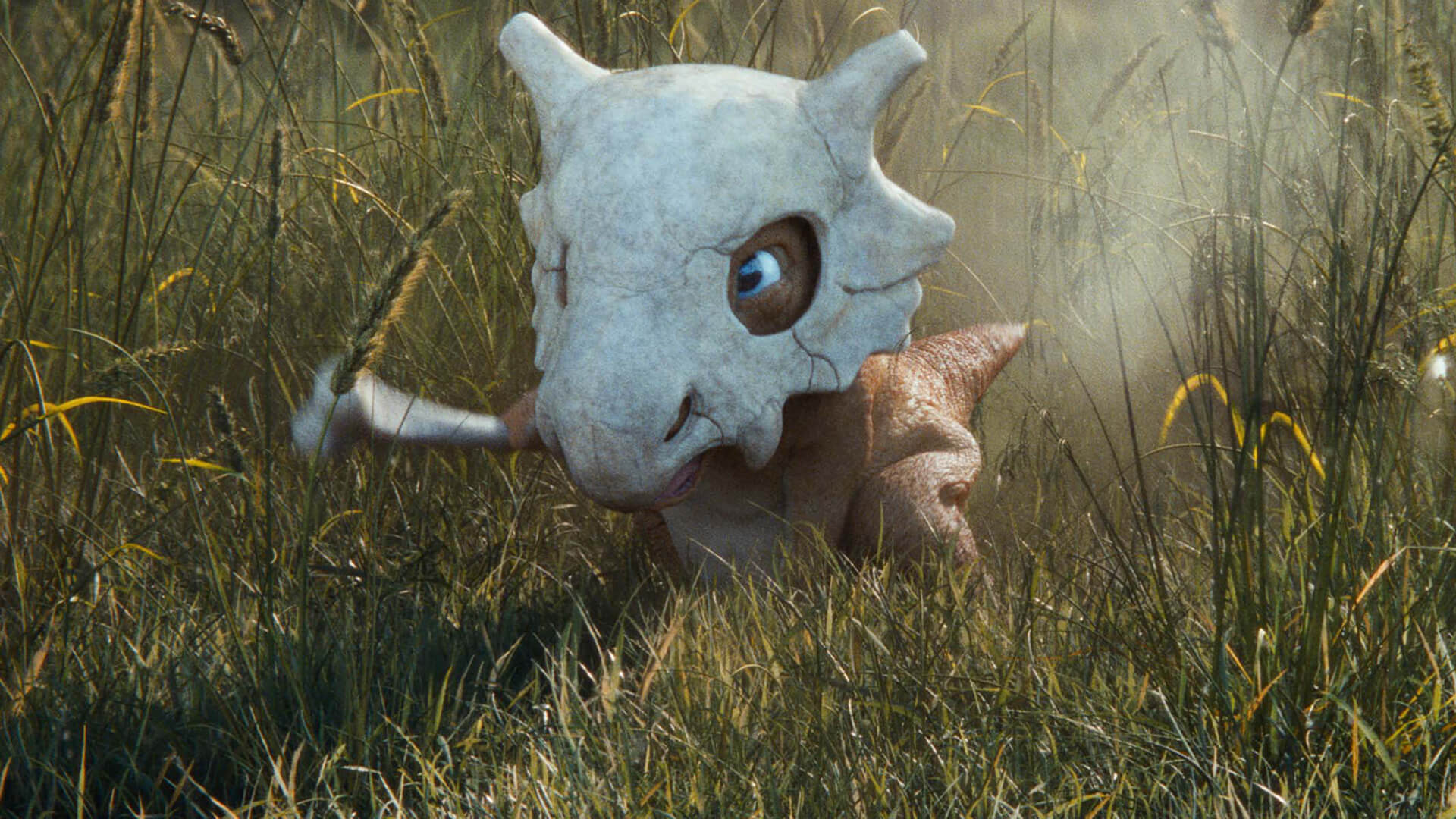 A small dinosaur character wearing a skull facemask