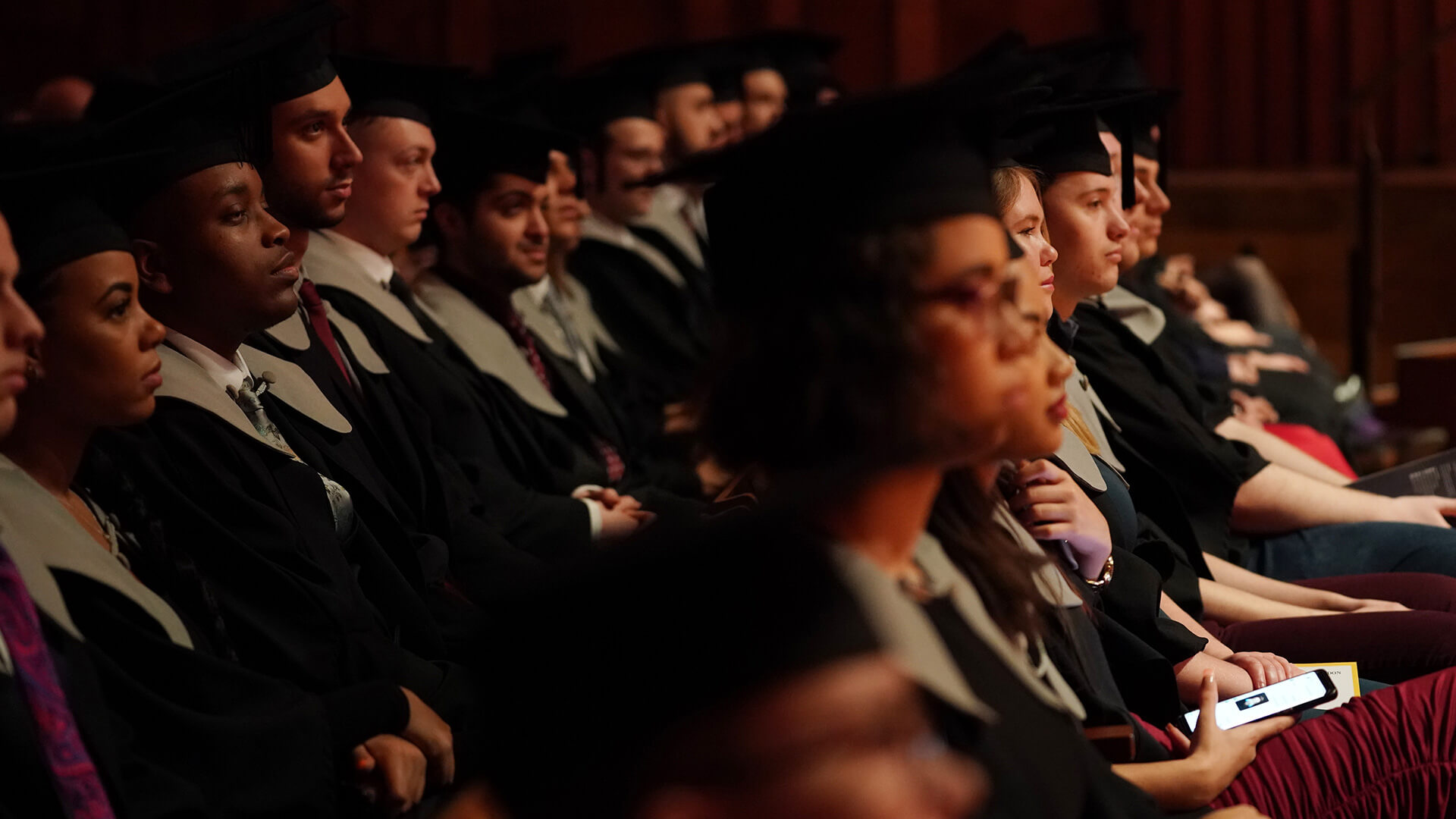 Students sat at graduation