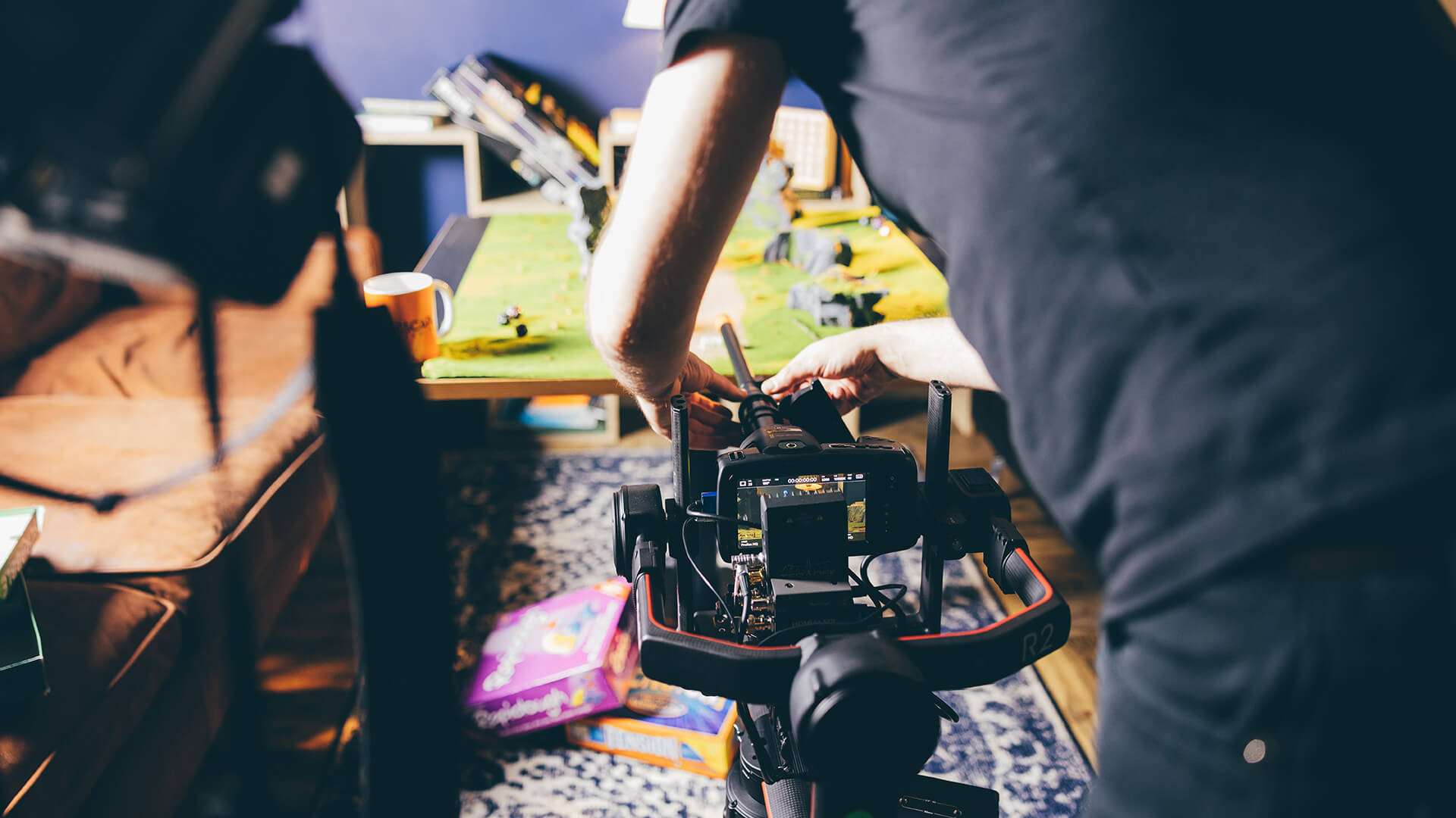 Tutor adjusting camera equipment