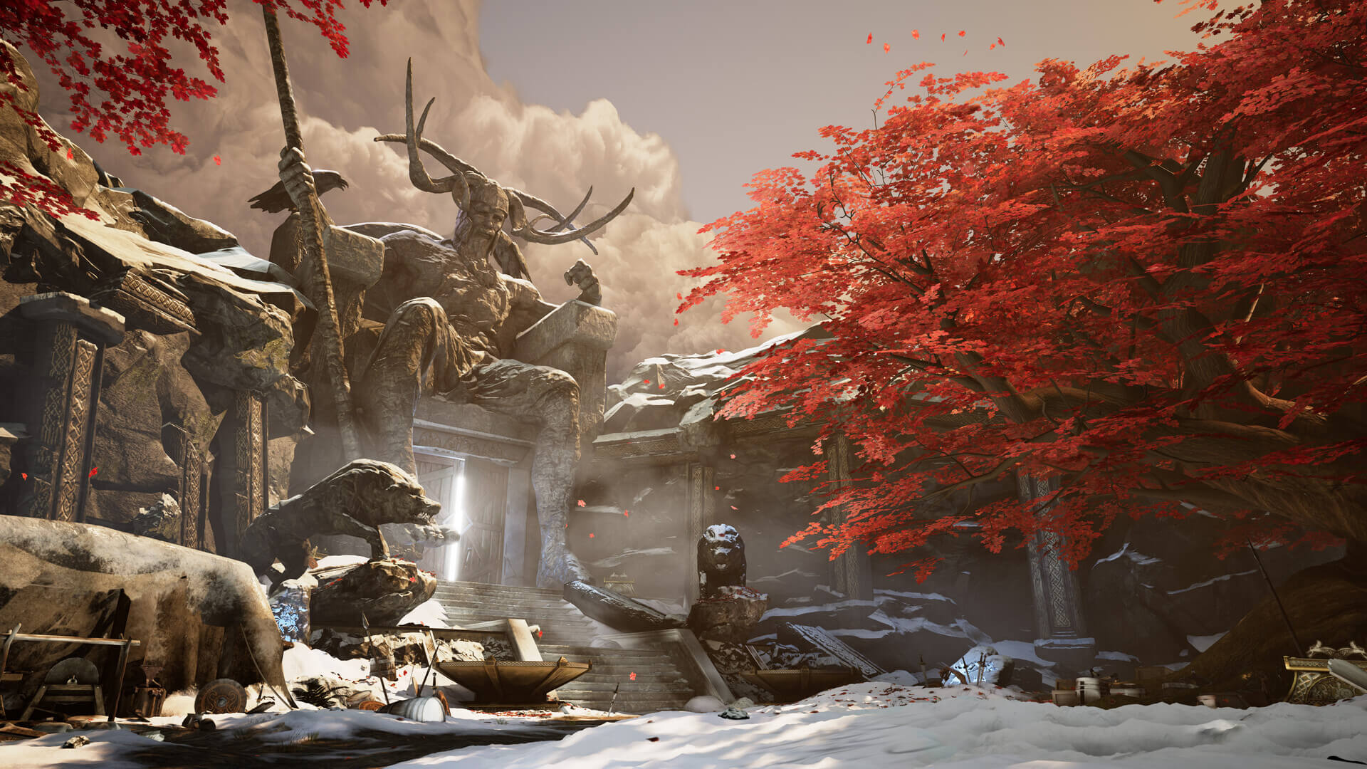 Red leaves on a tree surrounded by snow