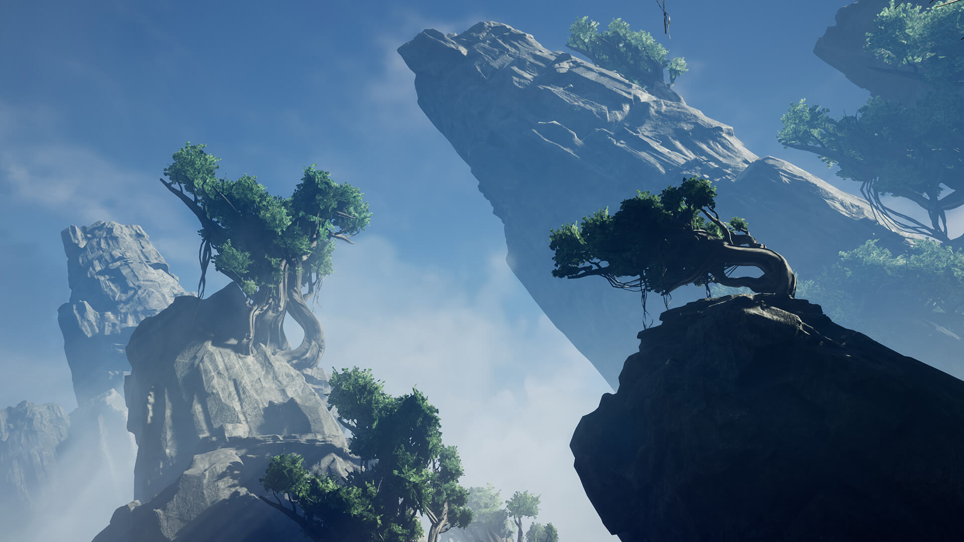 Mountain range covered in trees surrounded by mist