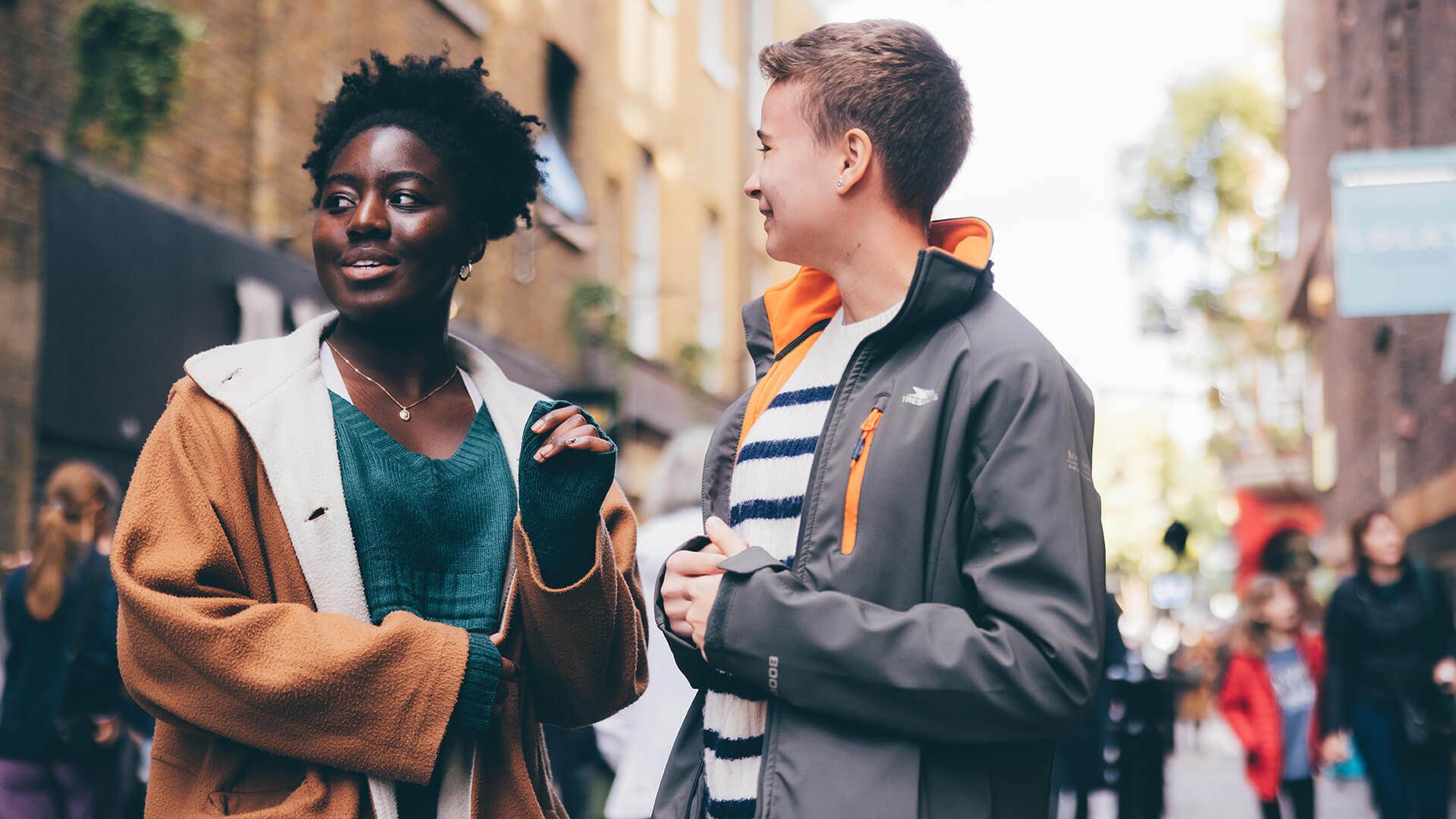 Two female students looking at street scape