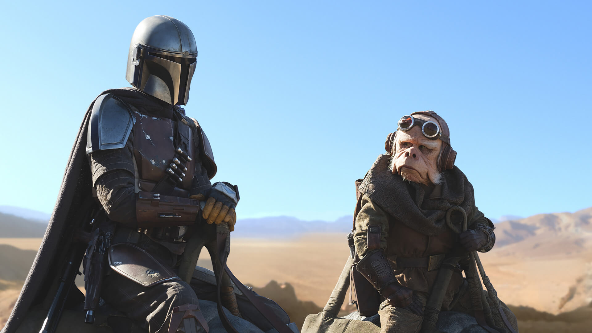 A silver spaceman and alien riding through the desert