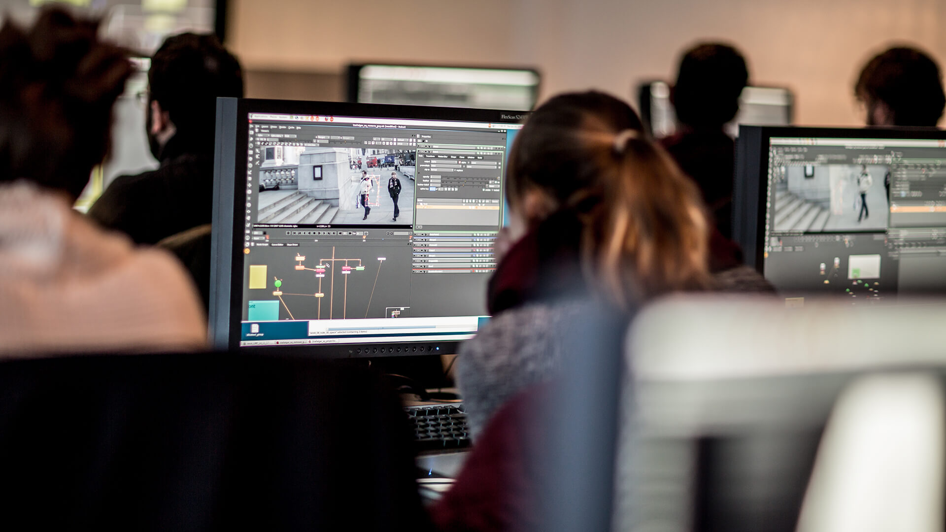 Student working at computer in a studio