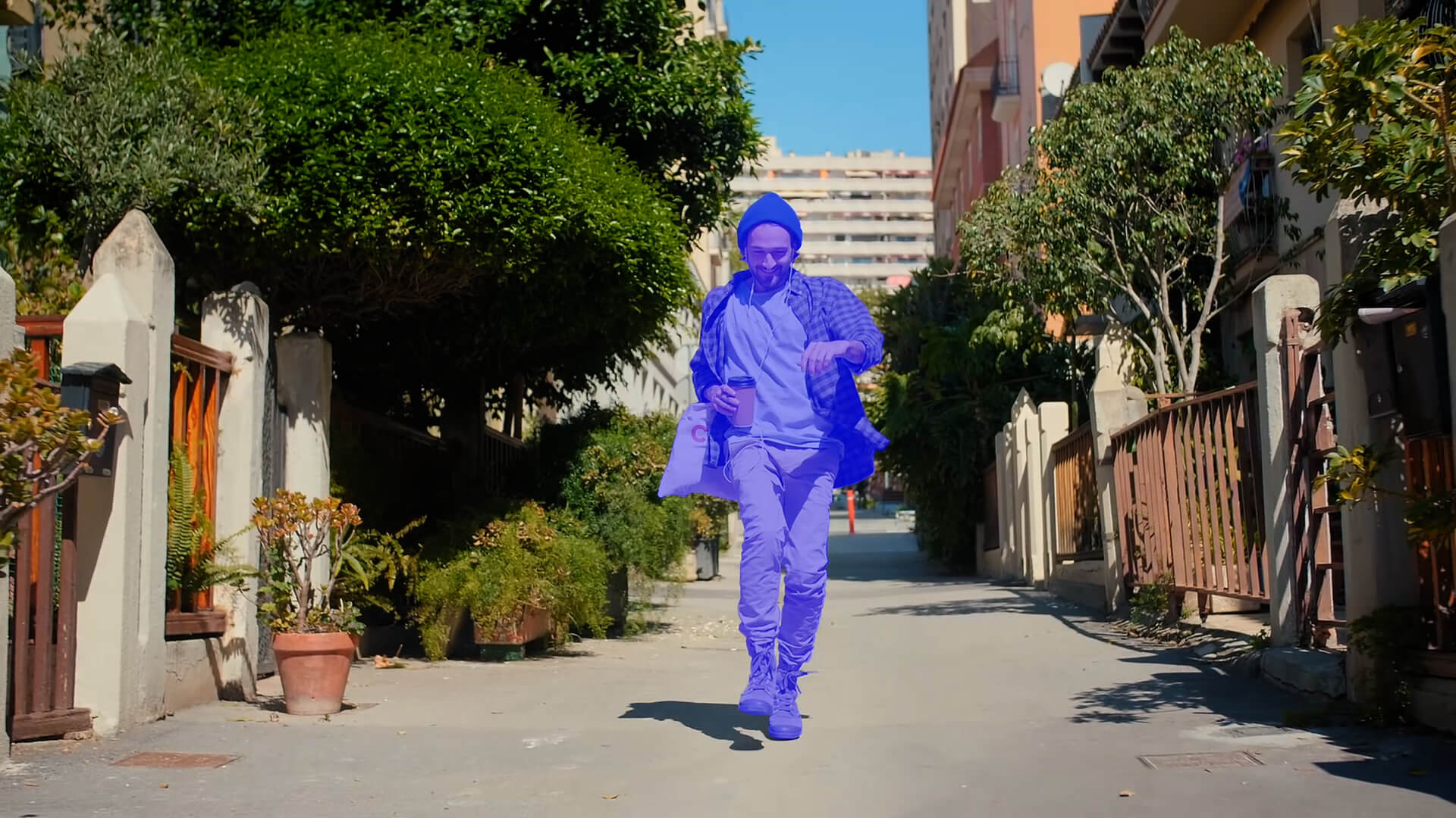 A blue cut out man inserted into a scene