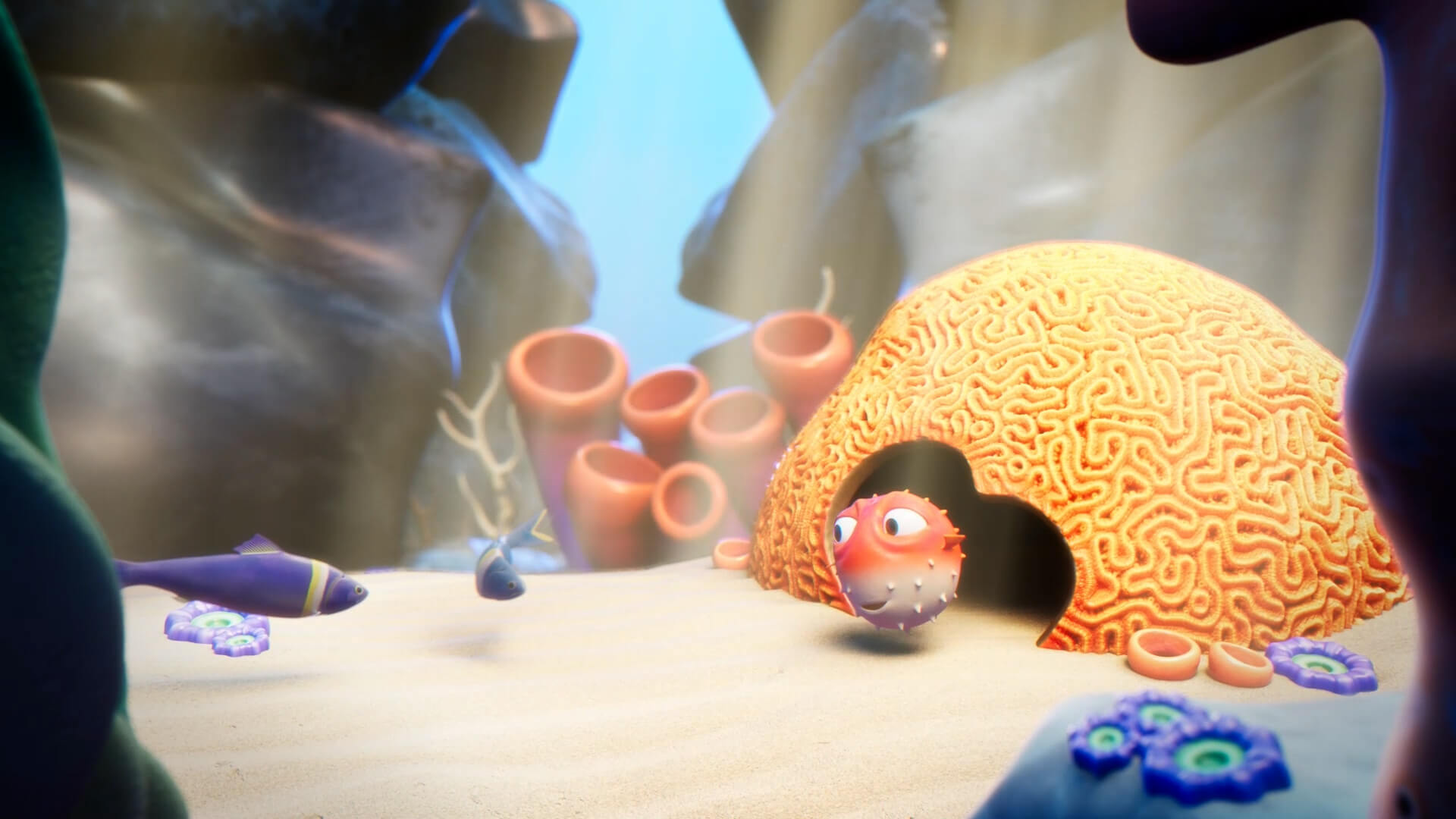 A red animated puffer fish swimming next to yellow coral