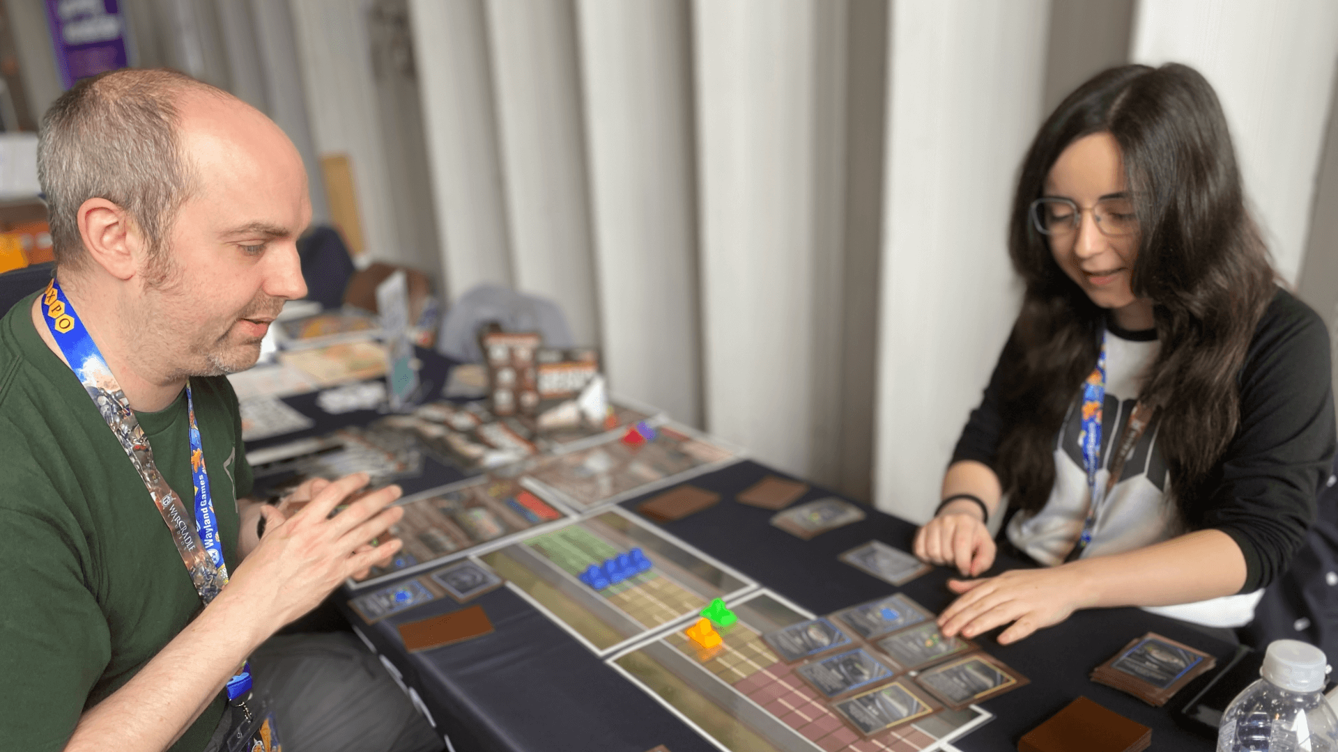 Two people playing a tabletop game at UK Game Expo 2025