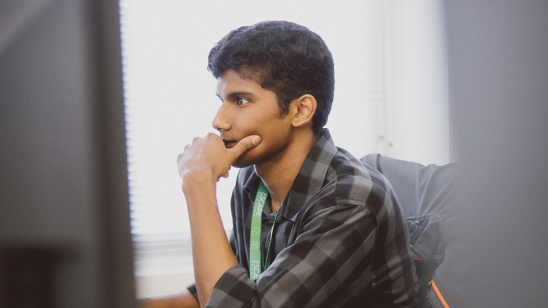 Male student sat at computer