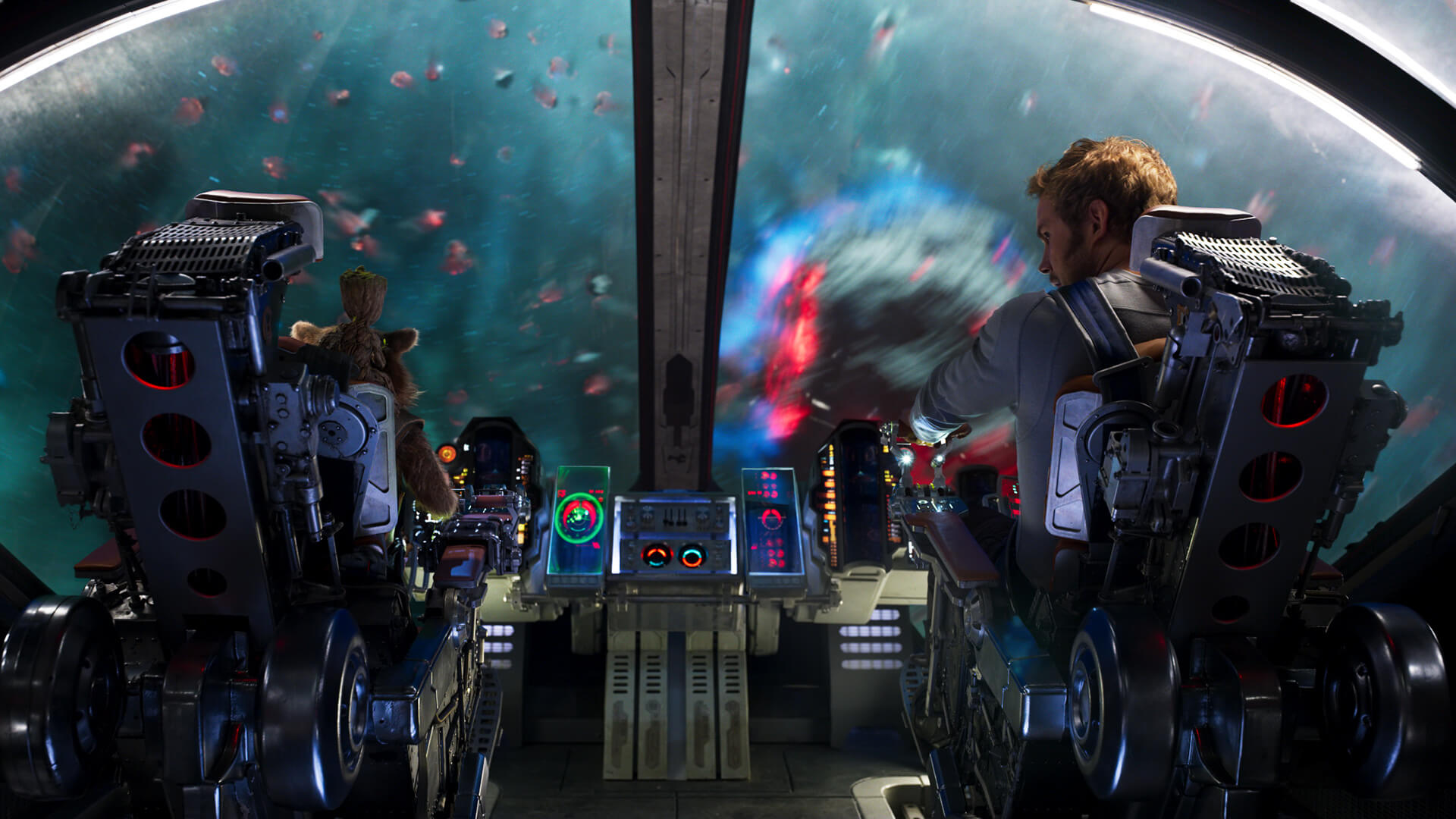 Animated racoon character sat next to a human piloting a spaceship