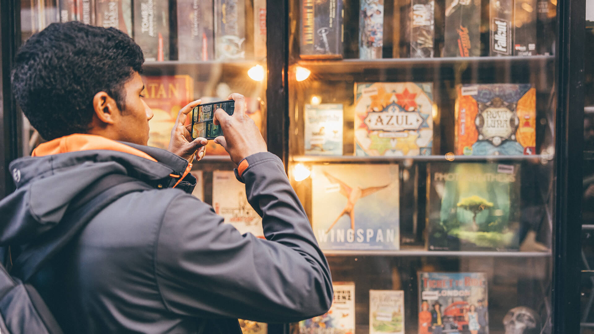 Male student taking a photo on mobile