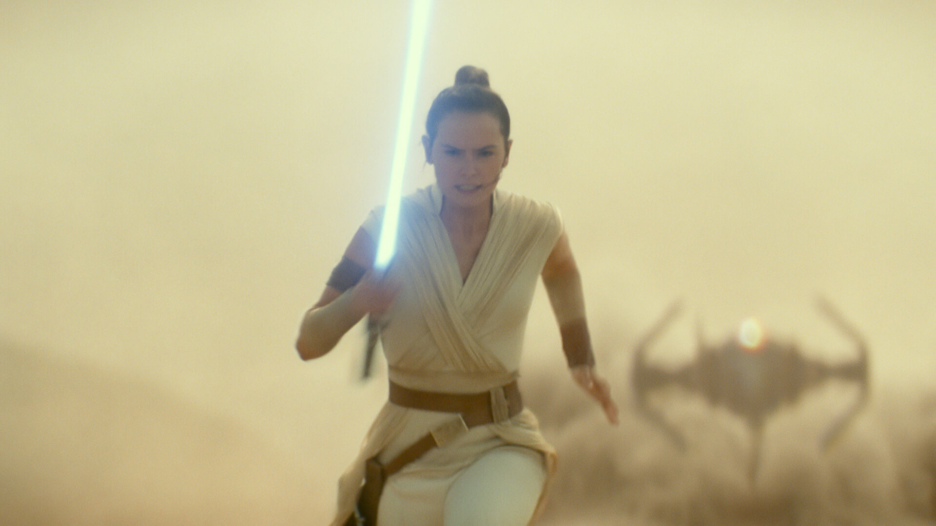 A female character running away from a spaceship in the desert